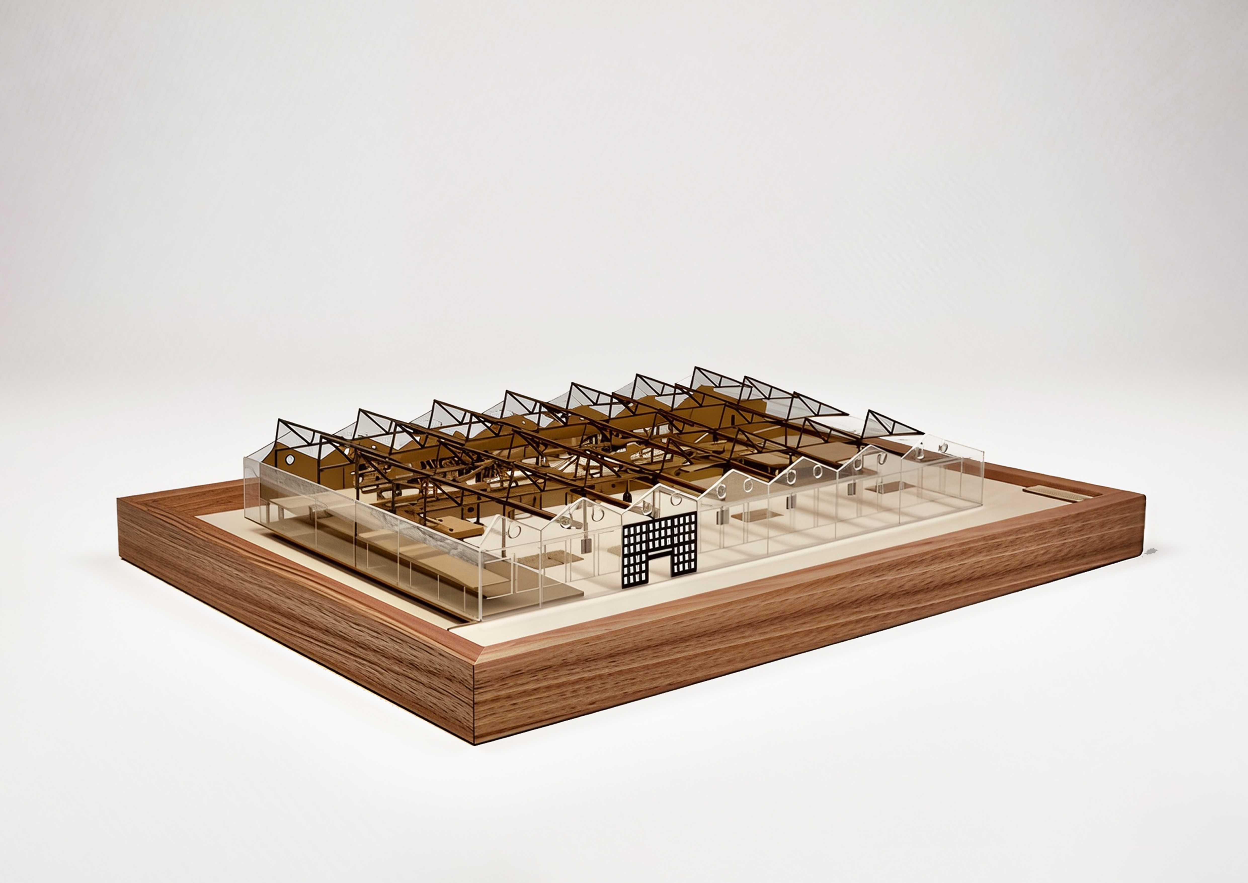 The physical model illustrates the relationship between the preserved structural frame and new insertions, highlighting how the open scaffold, sawtooth rhythm, and flexible platforms support an evolving, community-centered environment.