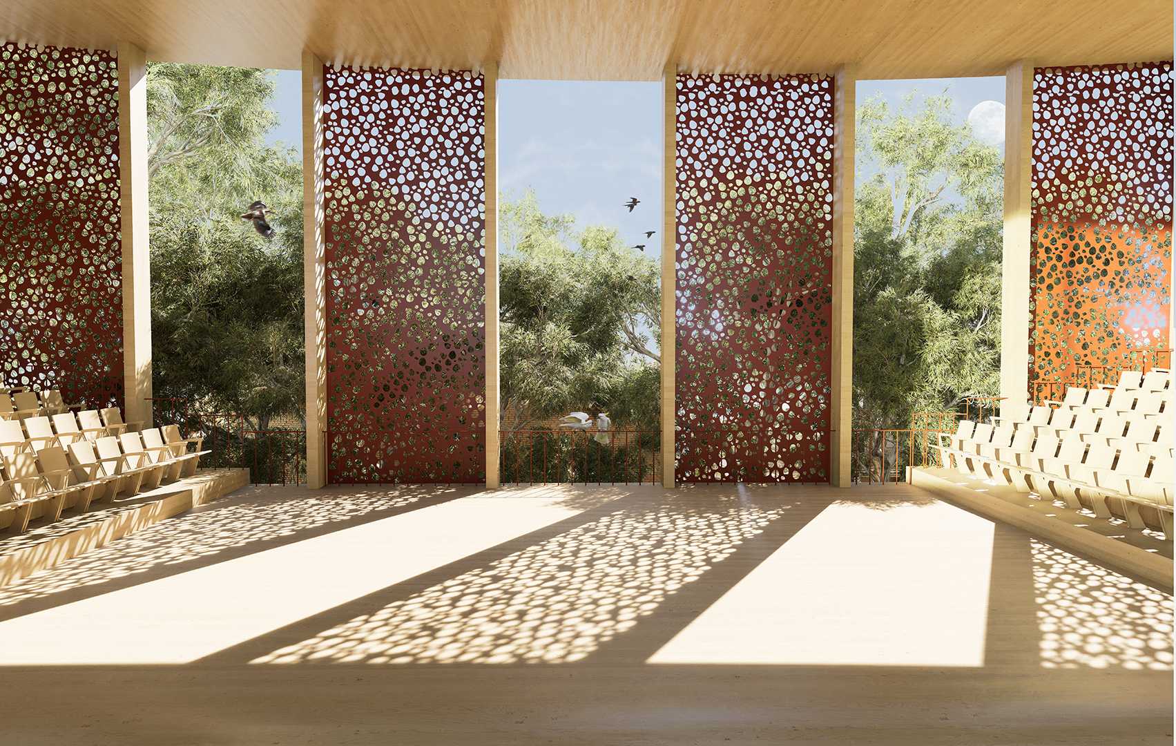 The auditorium is a non-hierarchical performance space that employs a backdrop of treetops, inviting in light, air, and life.