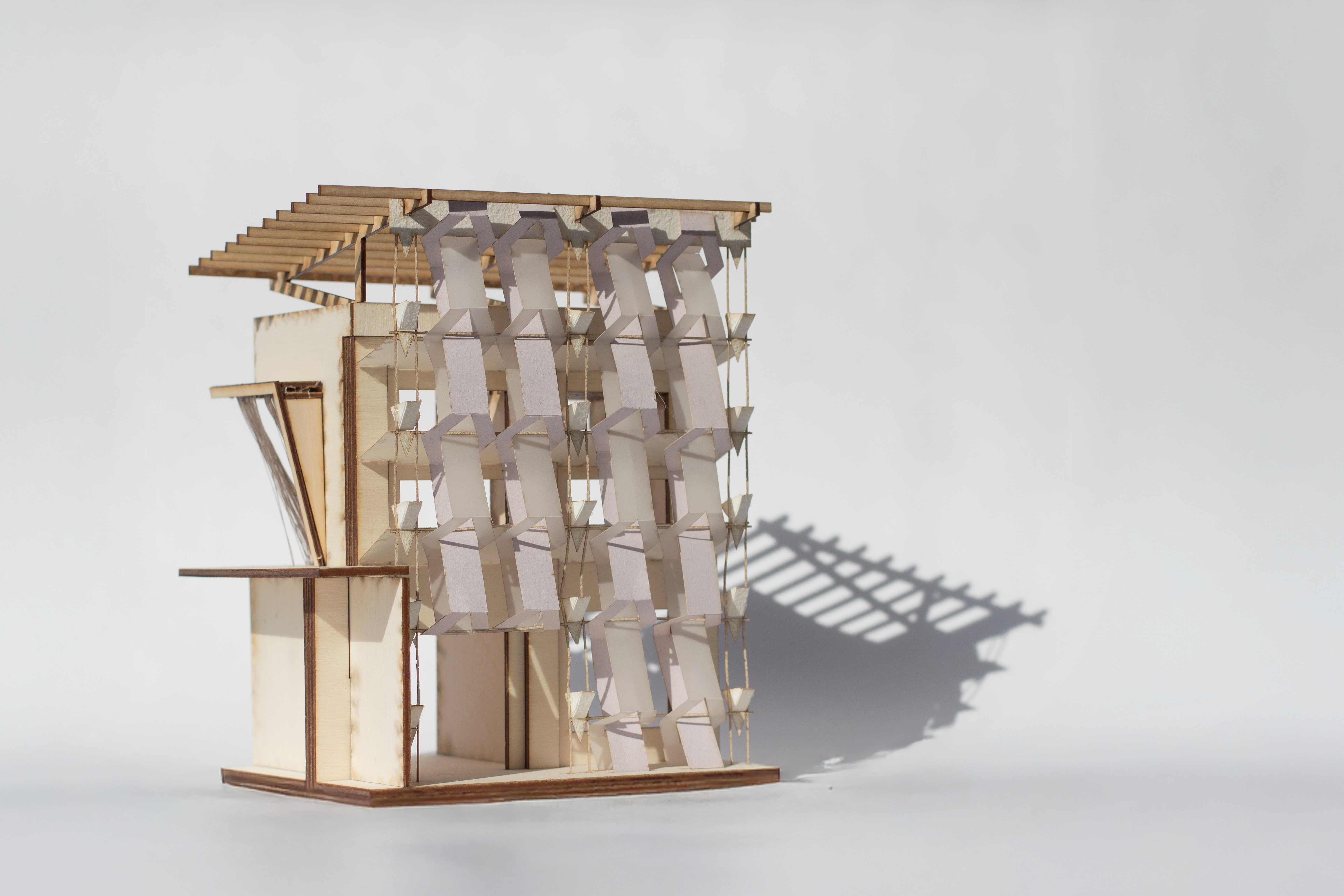 Model photograph of the re-façaded Argyle Railway Substation, featuring a geometrically patterned screen inspired by textile artist Peter Collingwood and reinterpreted as a sun-shading façade with integrated planting boxes.