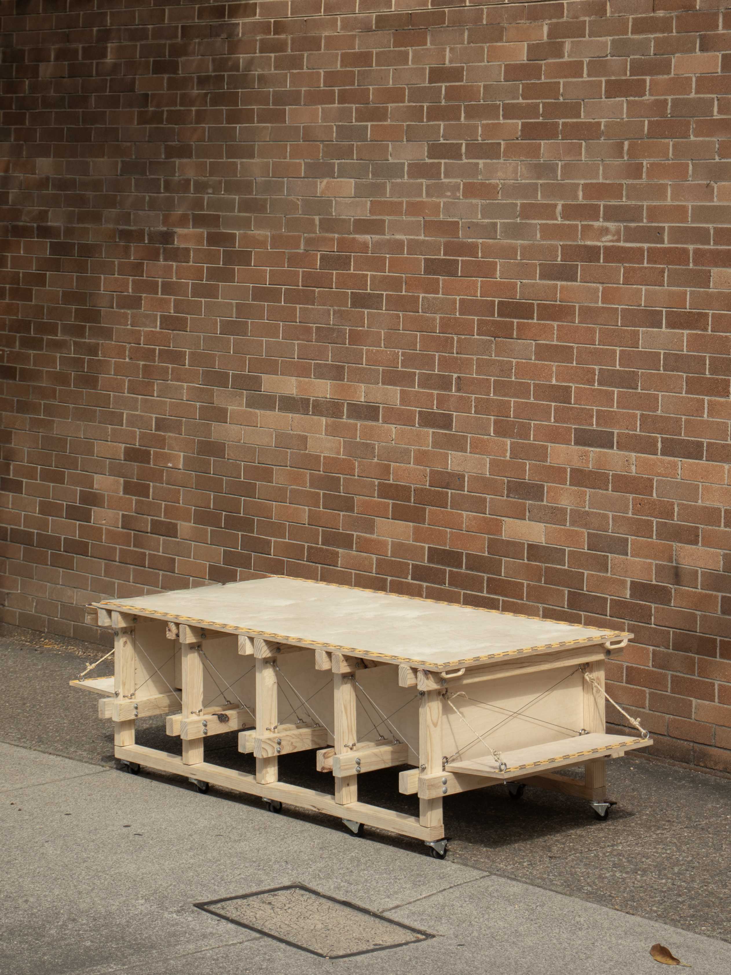 The module is constituted by a timber portal frame structure, lightweight in nature but stable enough to support the pulley suspension system, its payload, and performers.